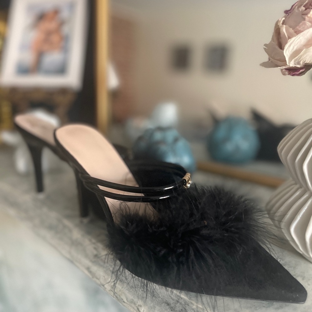 Brand new black feather heels.